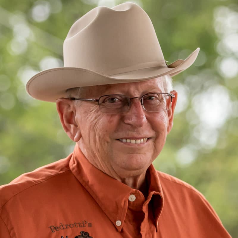 man smiling with cowboy hat