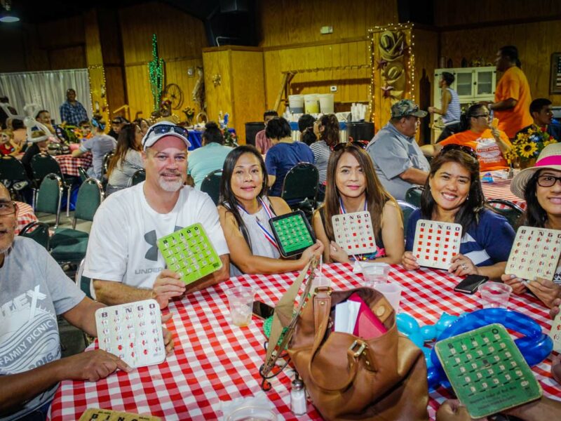 group of people at table playing bingo at our company picnic venue