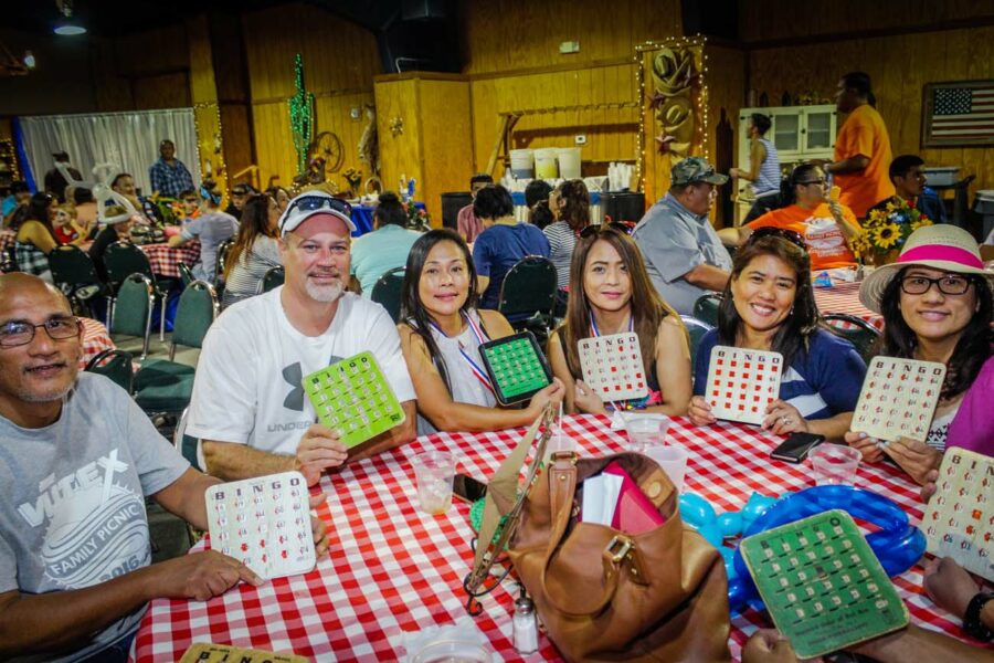 group of people at table playing bingo at our company picnic venue