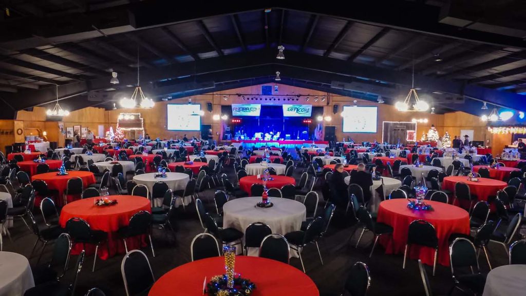 Corporate event with tables and stage up